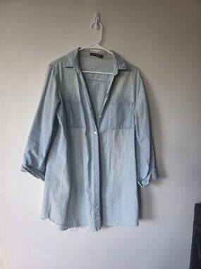 Light Wash Denim Button Up Shirt With A Raw Hem